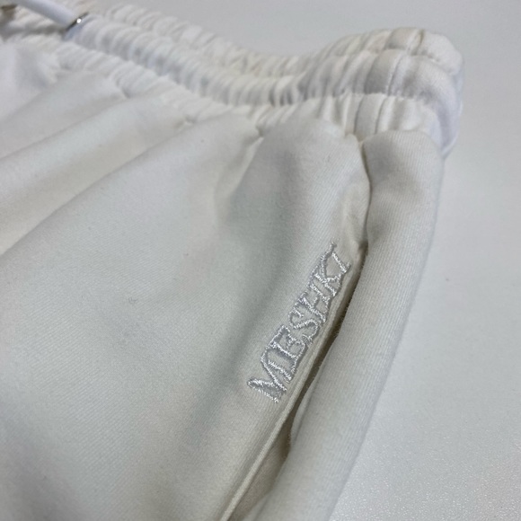 Meshki joggers with side pocket embroidery, drawstring, and pockets. Size xs. - Picture 2 of 5